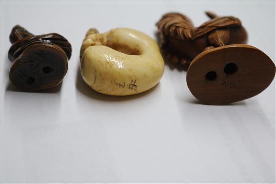 Four Japanese netsuke: one bronze, a cockerel, a dragon and figure on a gourd